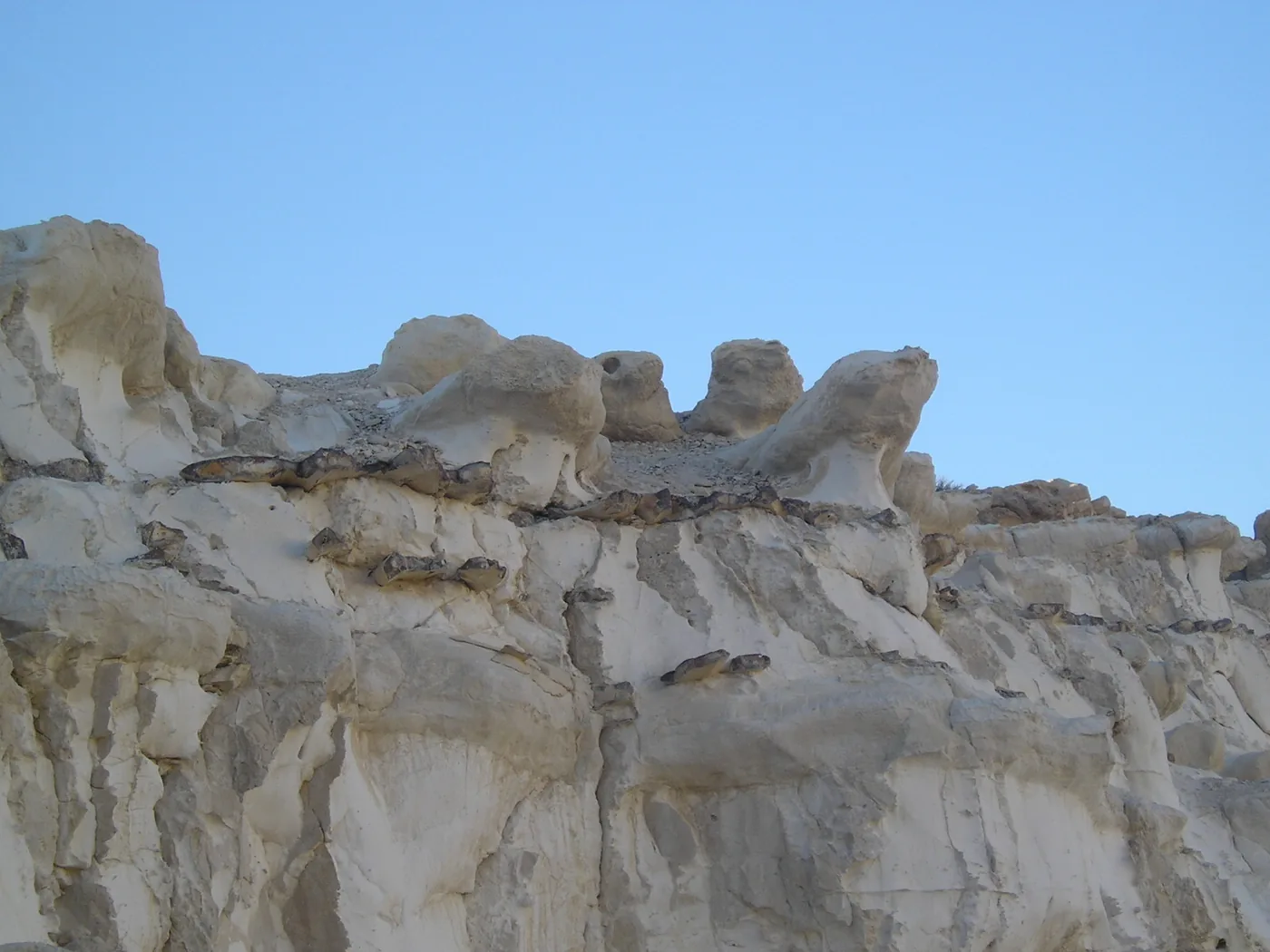 Pale chalk rocks and desert ground inside the Ramon Crater, Negev